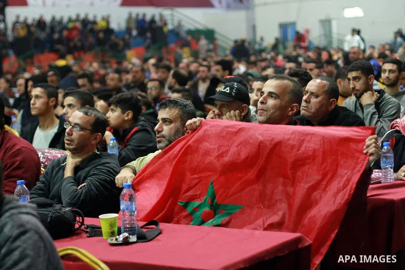 Palestinian football fans react as they watch on a large screen the Qatar World Cup 2022 Third-Place Playoff match between Morocco and Croatia, in Gaza city on December 17, 2022. Photo by Ali Hamad