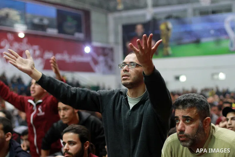 Palestinian football fans react as they watch on a large screen the Qatar World Cup 2022 Third-Place Playoff match between Morocco and Croatia, in Gaza city on December 17, 2022. Photo by Ali Hamad