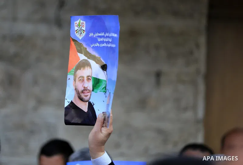 Palestinians take part in a protest following the death of prisoner Nasser Abu Hamid, in front of Red Cross office, in Gaza city, on December 20, 2022. Abu Hmeid, who entered into a coma two days ago and was yesterday tr...
