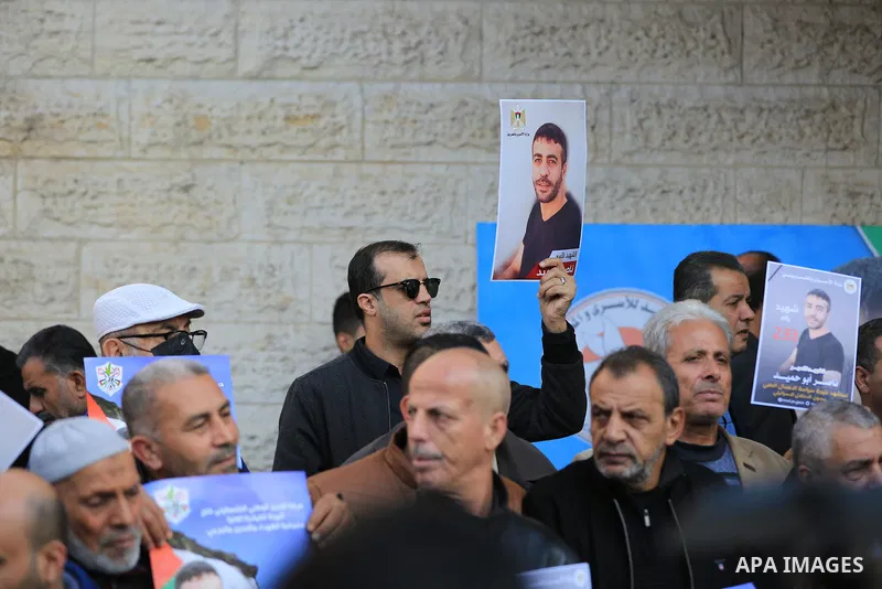 Palestinians take part in a protest following the death of prisoner Nasser Abu Hamid, in front of Red Cross office, in Gaza city, on December 20, 2022. Abu Hmeid, who entered into a coma two days ago and was yesterday tr...