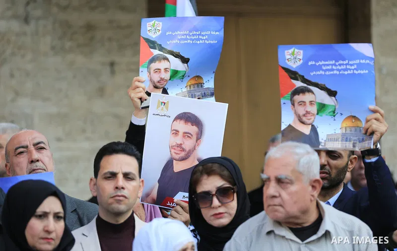 Palestinians take part in a protest following the death of prisoner Nasser Abu Hamid, in front of Red Cross office, in Gaza city, on December 20, 2022. Abu Hmeid, who entered into a coma two days ago and was yesterday tr...