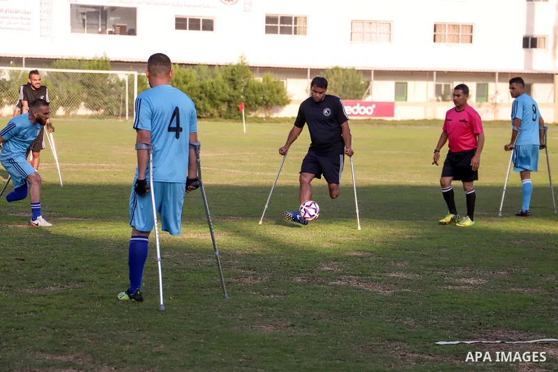 Palestinian players compete during the final of a local football championship for amputees organised by the International Committee of the Red Cross (ICRC), in Gaza City on December 20, 2022. According to The Internation...