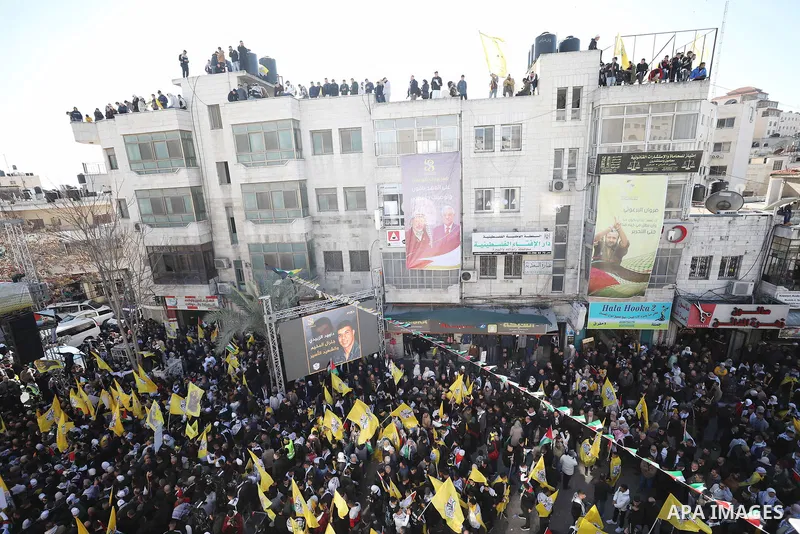 Palestinian supporters of the Fatah movement take part during a rally marking the 58th anniversary of the creation of the political party, in the West Bank city of Ramallah, on December 29, 2022. Photo by Wajed Nobani