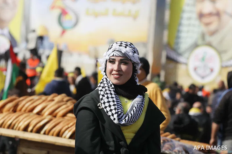 Palestinian supporters of the Fatah movement take part during a rally marking the 58th anniversary of the creation of the political party, in Gaza city, on December 31, 2022. Photo by Ashraf Amra\ apaimages