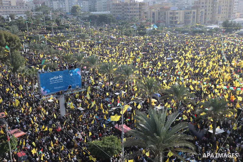 Palestinian supporters of the Fatah movement take part during a rally marking the 58th anniversary of the creation of the political party, in Gaza city, on December 31, 2022. Photo by Ashraf Amra\ apaimages
