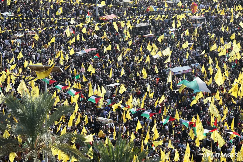 Palestinian supporters of the Fatah movement take part during a rally marking the 58th anniversary of the creation of the political party, in Gaza city, on December 31, 2022. Photo by Ashraf Amra\ apaimages