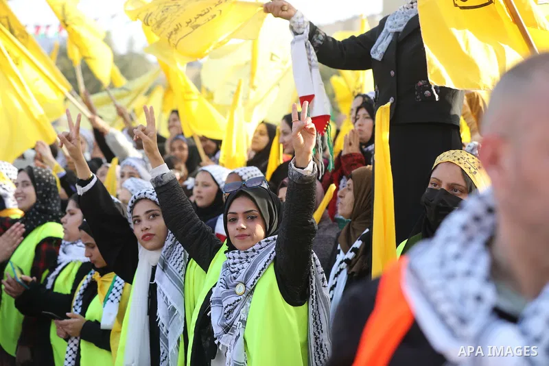 Palestinian supporters of the Fatah movement take part during a rally marking the 58th anniversary of the creation of the political party, in Gaza city, on December 31, 2022. Photo by Ashraf Amra\ apaimages