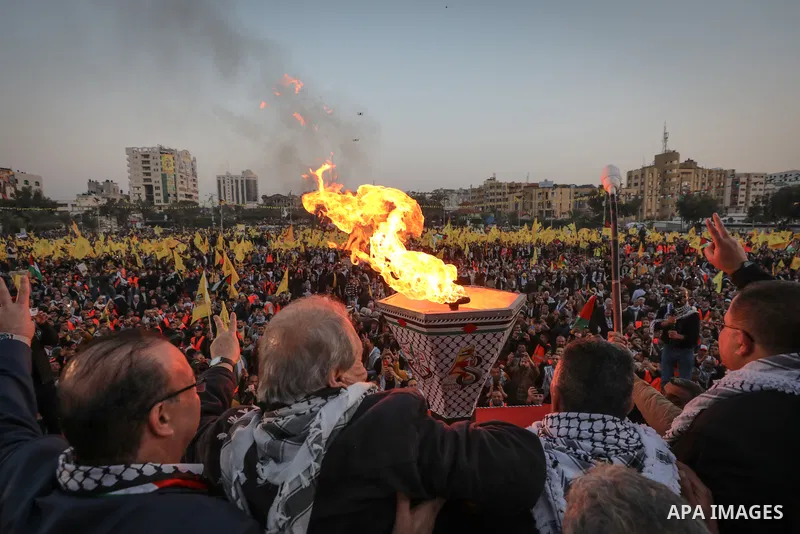 Palestinians light a torch during a celebration marking the 58th anniversary of Fatah movement foundation, in Gaza city, on December 31, 2022. Photo by Nidal Al-Wahidi \ apaimages