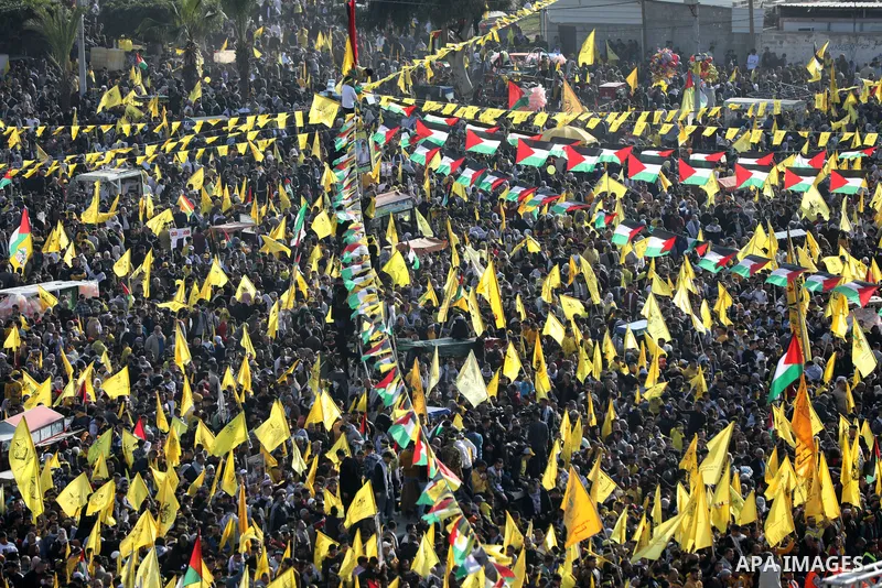 Palestinian supporters of the Fatah movement take part during a rally marking the 58th anniversary of the creation of the political party, in Gaza city, on December 31, 2022. Photo by Ashraf Amra\ apaimages