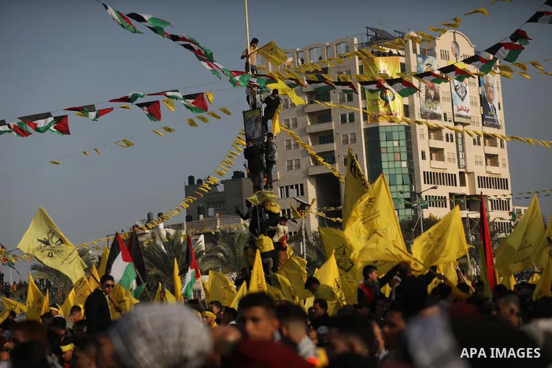 Palestinian supporters of the Fatah movement take part during a rally marking the 58th anniversary of the creation of the political party, in Gaza city, on December 31, 2022. Photo by Ashraf Amra\ apaimages
