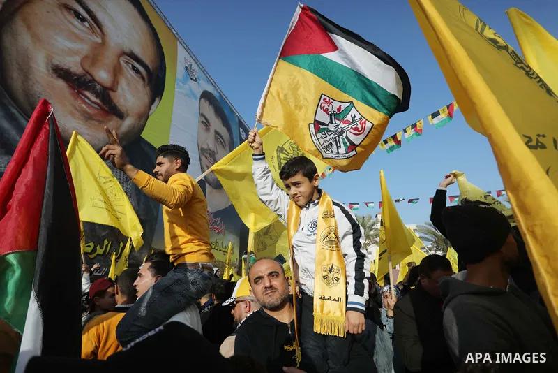 Palestinian supporters of the Fatah movement take part during a rally marking the 58th anniversary of the creation of the political party, in Gaza city, on December 31, 2022. Photo by Ashraf Amra\ apaimages