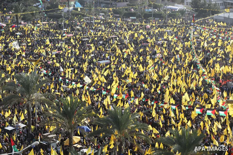 Palestinian supporters of the Fatah movement take part during a rally marking the 58th anniversary of the creation of the political party, in Gaza city, on December 31, 2022. Photo by Ashraf Amra\ apaimages