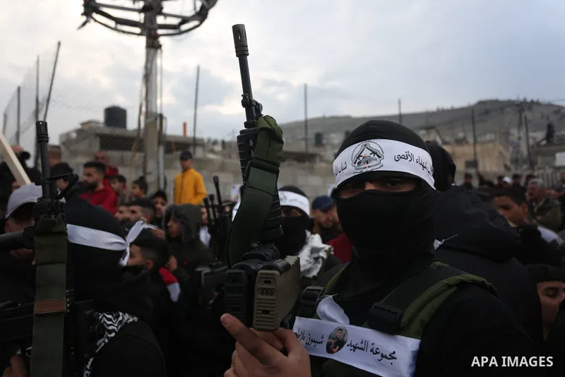Palestinian gunmen from the Balata Brigade of the Fatah movement carry their weapons and show off their strength, during a memorial ceremony of the Palestinian Mahdi Hashash who was killed by the Israeli army at the Bala...
