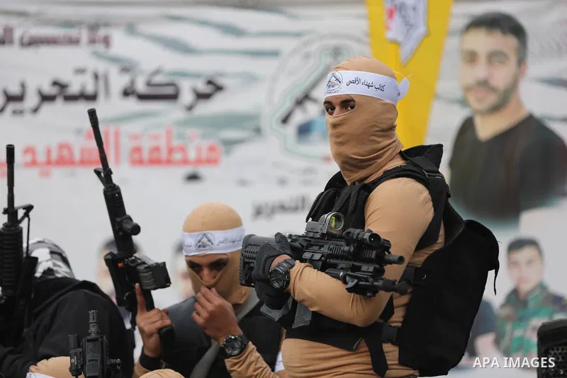 Palestinian gunmen from the Balata Brigade of the Fatah movement carry their weapons and show off their strength, during a memorial ceremony of the Palestinian Mahdi Hashash who was killed by the Israeli army at the Bala...