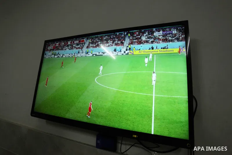 Palestinians listen to TV during the match between Morocco VS Canada, in the Qatar World Cup FIFA 2022, in Gaza city on December 1, 2022. There are at least 130,000 Palestinian people aged 50 years and older who live wit...