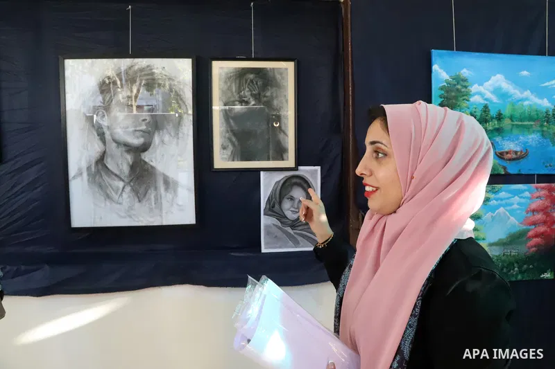 Palestinians participate in an arts and culture exhibition held at the Egyptian Community Cultural Center, in Gaza city on December 1, 2022. Photo by Youssef Abu Watfa \ apaimages