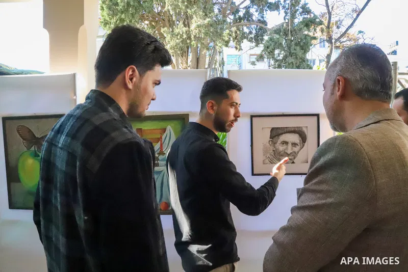 Palestinians participate in an arts and culture exhibition held at the Egyptian Community Cultural Center, in Gaza city on December 1, 2022. Photo by Youssef Abu Watfa \ apaimages