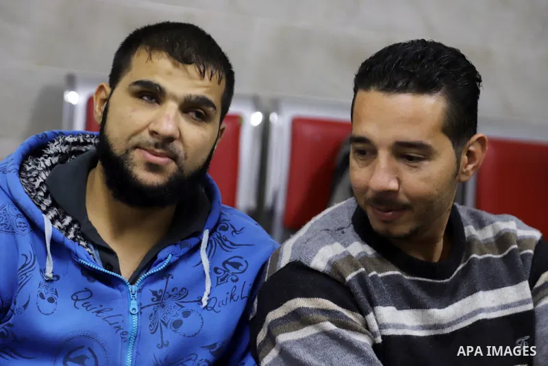Palestinians listen to TV during the match between Morocco VS Canada, in the Qatar World Cup FIFA 2022, in Gaza city on December 1, 2022. There are at least 130,000 Palestinian people aged 50 years and older who live wit...