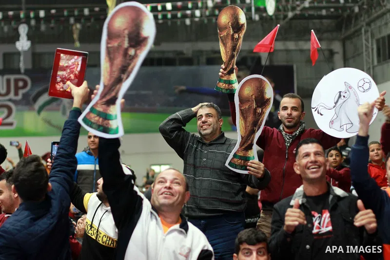 Palestinian fans attend the match between Morocco VS Canada, in the Qatar World Cup FIFA 2022, via a huge screen at a public place in Gaza city on December 1, 2022. The 2022 FIFA World Cup is an association football tour...