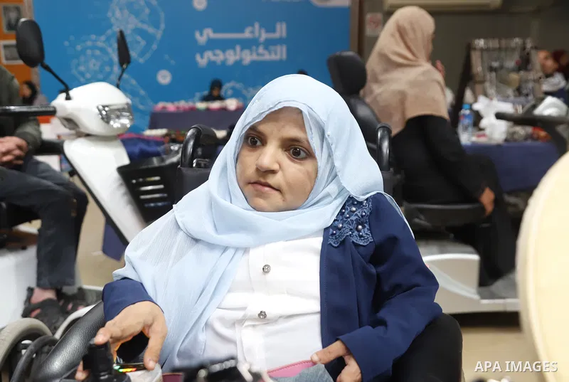 Palestinian women with disabilities Rana, 35, and Randa, 39 Ashour suffer from Fanconi syndrome display their products at an exhibition on the occasion of the International Day of Disabled Persons in Gaza city on Decembe...