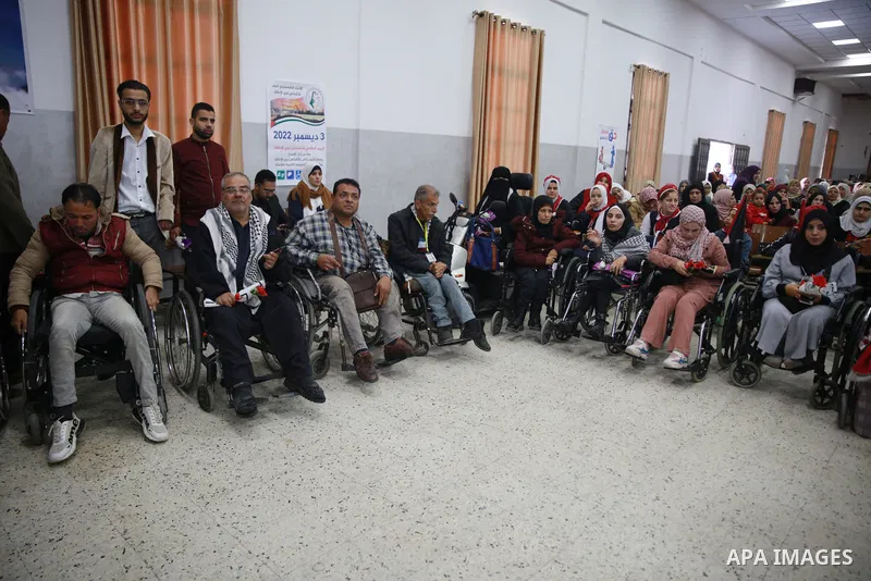 Palestinians attend a celebration on the occasion of the International Day of Disabled Persons in Gaza city on December 3, 2022. The annual observance of the International Day of Disabled Persons was proclaimed in 1992,...