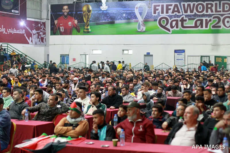 Palestinian fans attend the match between Argentina VS Australia, in the Qatar World Cup FIFA 2022, via a huge screen at a public place in Gaza city on December 3, 2022. Photo by Ali Hamad\ apaimages
