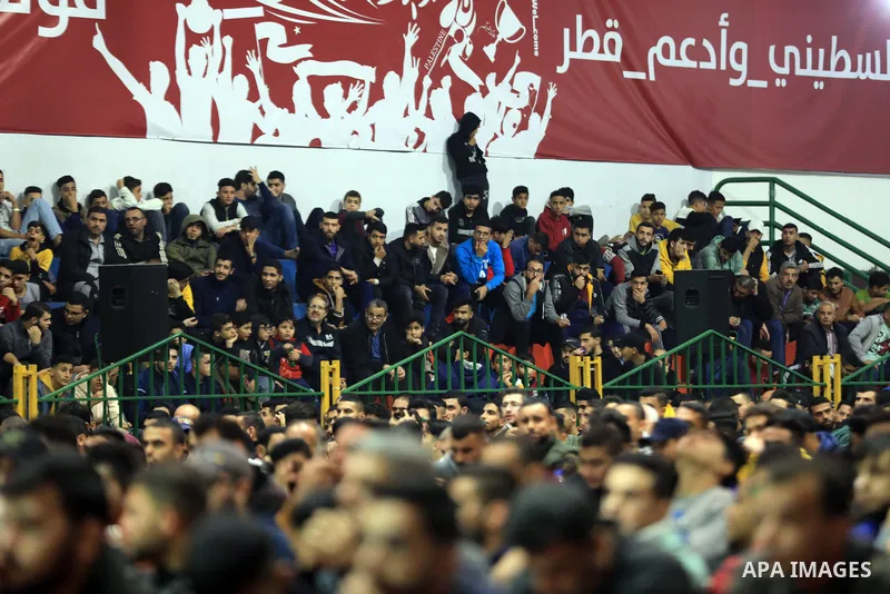 Palestinian fans attend the match between Argentina VS Australia, in the Qatar World Cup FIFA 2022, via a huge screen at a public place in Gaza city on December 3, 2022. Photo by Ali Hamad\ apaimages