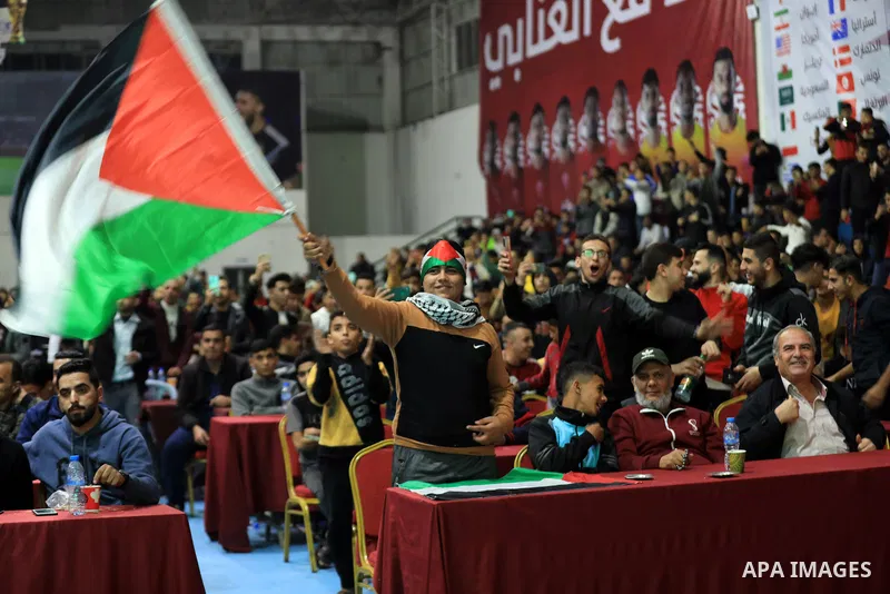Palestinian fans attend the match between Argentina VS Australia, in the Qatar World Cup FIFA 2022, via a huge screen at a public place in Gaza city on December 3, 2022. Photo by Ali Hamad\ apaimages