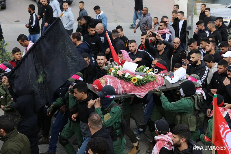 Palestinians carry the body of Omar Manaa, 22, shot dead by Israeli forces amid clashes earlier during a raid, at his funeral in the Dheisheh refugee camp near the West Bank city of Bethlehem, on December 5, 2022. Photo...