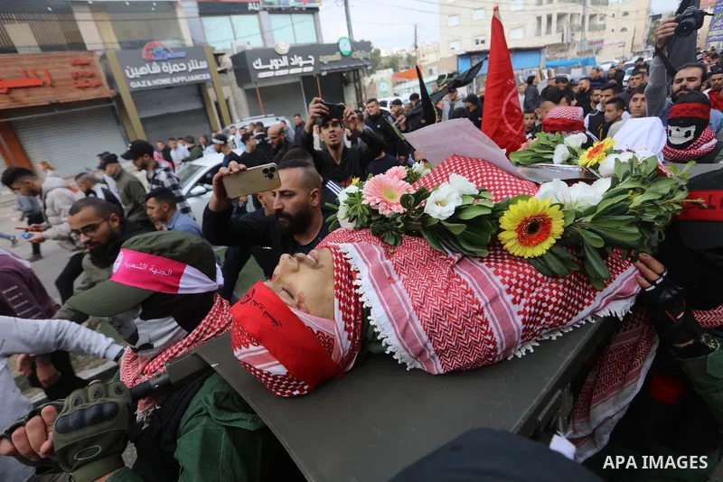 Palestinians carry the body of Omar Manaa, 22, shot dead by Israeli forces amid clashes earlier during a raid, at his funeral in the Dheisheh refugee camp near the West Bank city of Bethlehem, on December 5, 2022. Photo...