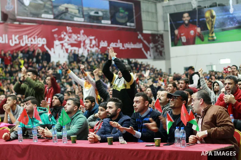 Palestinian fans celebrate after Morocco's victory over Spain in the World Cup in Qatar 2022, in Gaza city on December 6, 2022. Photo by Ali Hamad\ apaimages