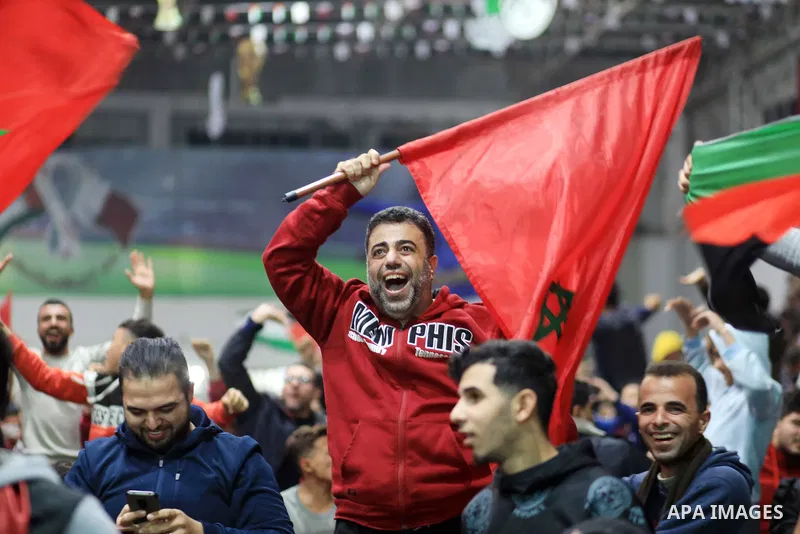 Palestinian fans celebrate after Morocco's victory over Spain in the World Cup in Qatar 2022, in Gaza city on December 6, 2022. Photo by Ali Hamad\ apaimages
