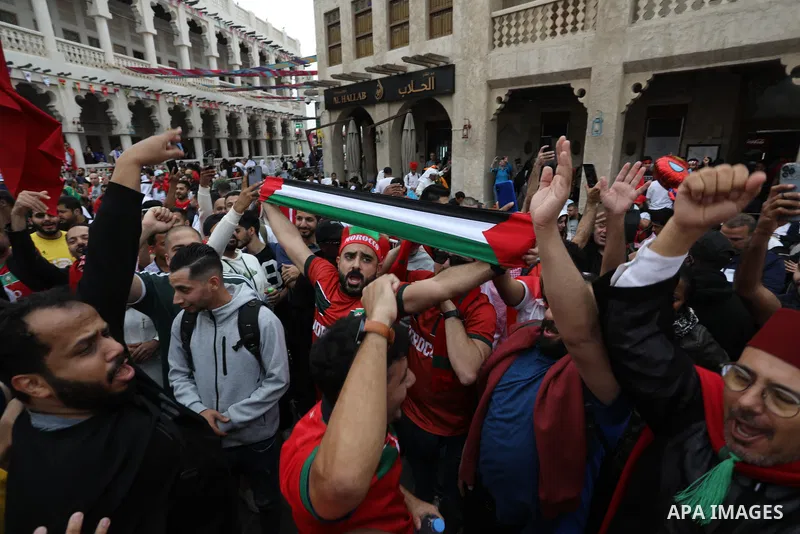 Fans gather in the streets of Doha ahead of the match Morocco vs Portugal in FIFA World Cup, in Doha, Qatar on December 10, 2022. The 2022 FIFA World Cup is an association football tournament, contested by the men's nati...