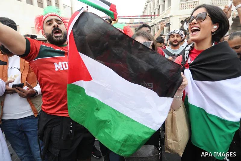 Fans gather in the streets of Doha ahead of the match Morocco vs Portugal in FIFA World Cup, in Doha, Qatar on December 10, 2022. The 2022 FIFA World Cup is an association football tournament, contested by the men's nati...