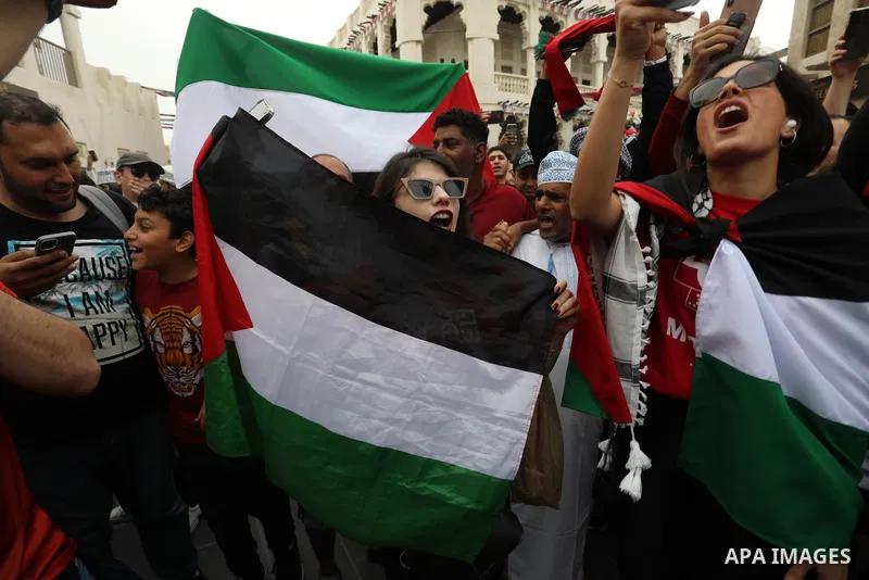 Fans gather in the streets of Doha ahead of the match Morocco vs Portugal in FIFA World Cup, in Doha, Qatar on December 10, 2022. The 2022 FIFA World Cup is an association football tournament, contested by the men's nati...