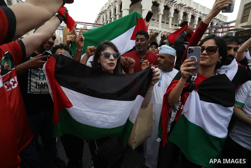 Fans gather in the streets of Doha ahead of the match Morocco vs Portugal in FIFA World Cup, in Doha, Qatar on December 10, 2022. The 2022 FIFA World Cup is an association football tournament, contested by the men's nati...