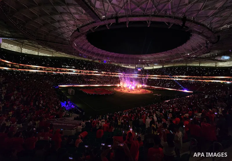 Fans cheer in the stadium during Morocco vs Portugal match in FIFA World Cup, in Doha, Qatar on December 10, 2022. The 2022 FIFA World Cup is an association football tournament, contested by the men's national teams of F...