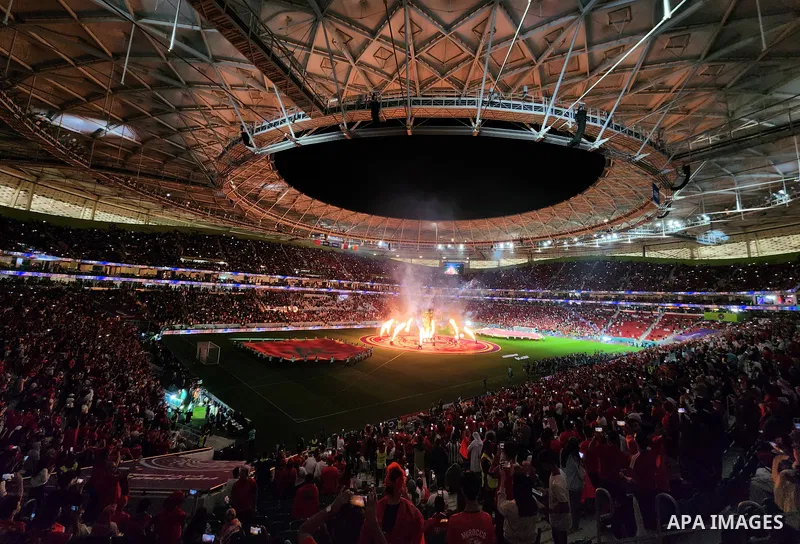 Fans cheer in the stadium during Morocco vs Portugal match in FIFA World Cup, in Doha, Qatar on December 10, 2022. The 2022 FIFA World Cup is an association football tournament, contested by the men's national teams of F...