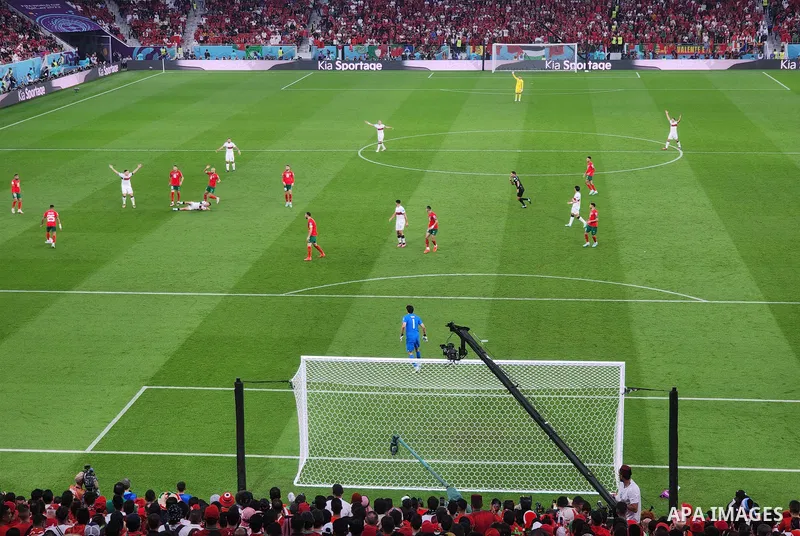 Fans cheer in the stadium during Morocco vs Portugal match in FIFA World Cup, in Doha, Qatar on December 10, 2022. The 2022 FIFA World Cup is an association football tournament, contested by the men's national teams of F...