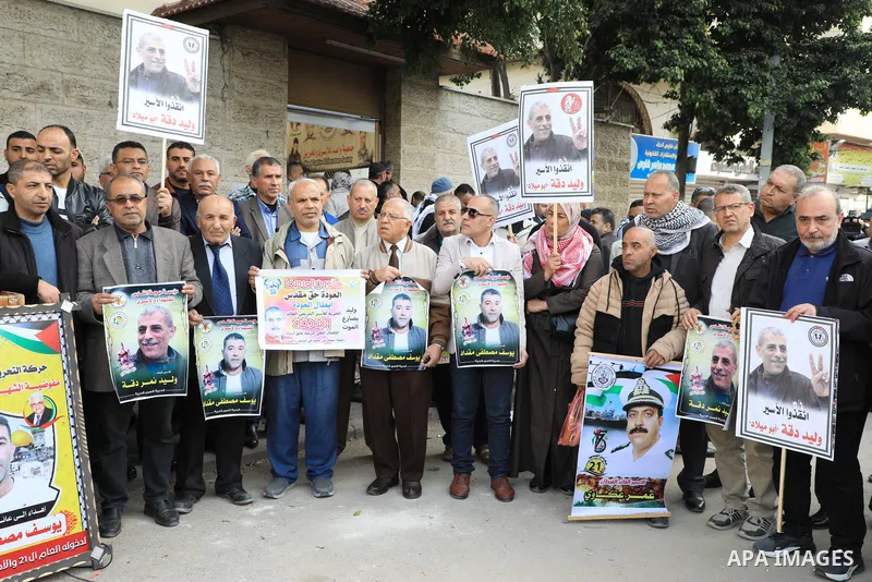 Palestinians take part in a protest in support prisoners in Israeli jails, in front of Red Cross office in Gaza city on December 12, 2022. PPS stressed that the administrative detentions in 2022 were the most serious whe...