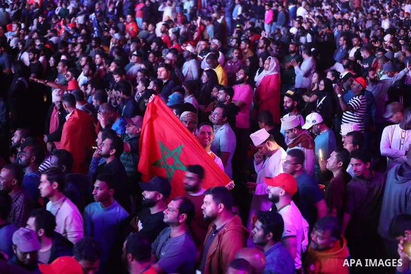 Fans attend on a huge screen the semi-final match between Morocco and France on the Doha Corniche on December 14, 2022. The 2022 FIFA World Cup is an association football tournament, contested by the men's national teams...