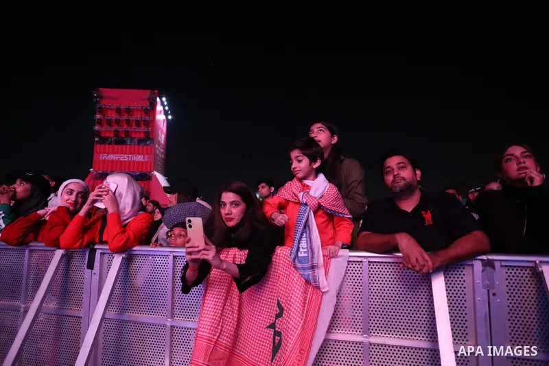 Fans attend on a huge screen the semi-final match between Morocco and France on the Doha Corniche on December 14, 2022. The 2022 FIFA World Cup is an association football tournament, contested by the men's national teams...