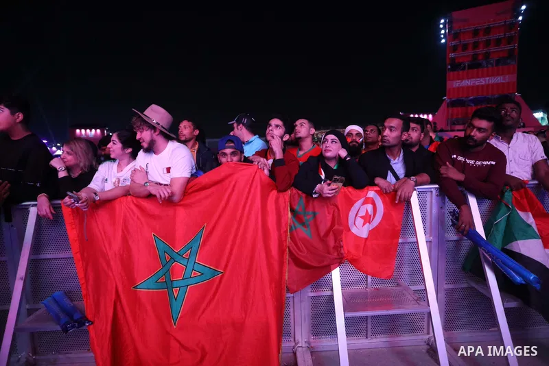 Fans attend on a huge screen the semi-final match between Morocco and France on the Doha Corniche on December 14, 2022. The 2022 FIFA World Cup is an association football tournament, contested by the men's national teams...