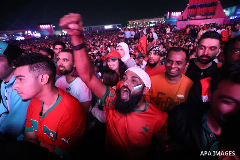 Fans attend on a huge screen the semi-final match between Morocco and France on the Doha Corniche on December 14, 2022. The 2022 FIFA World Cup is an association football tournament, contested by the men's national teams...