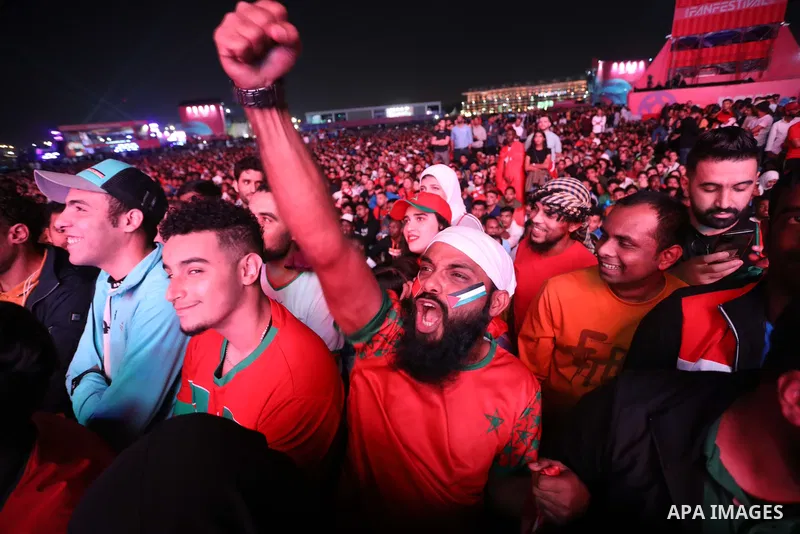 Fans attend on a huge screen the semi-final match between Morocco and France on the Doha Corniche on December 14, 2022. The 2022 FIFA World Cup is an association football tournament, contested by the men's national teams...