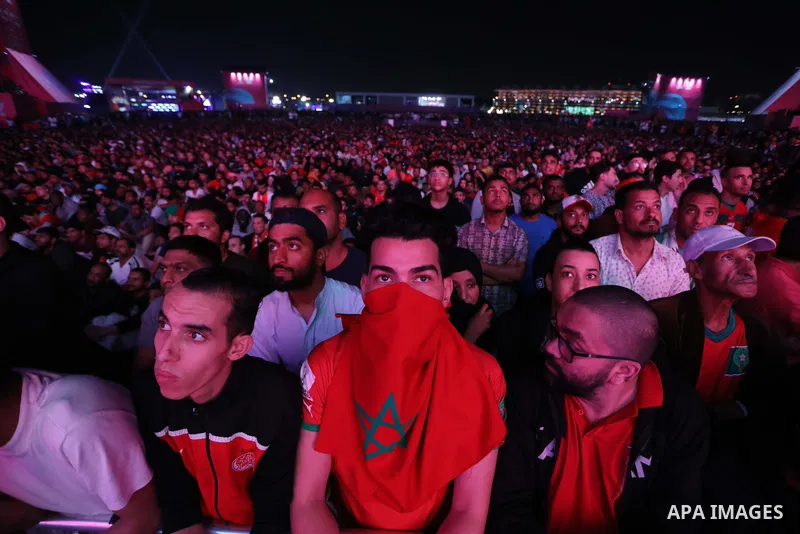 Fans attend on a huge screen the semi-final match between Morocco and France on the Doha Corniche on December 14, 2022. The 2022 FIFA World Cup is an association football tournament, contested by the men's national teams...