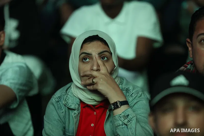 Fans attend on a huge screen the semi-final match between Morocco and France on the Doha Corniche on December 14, 2022. The 2022 FIFA World Cup is an association football tournament, contested by the men's national teams...