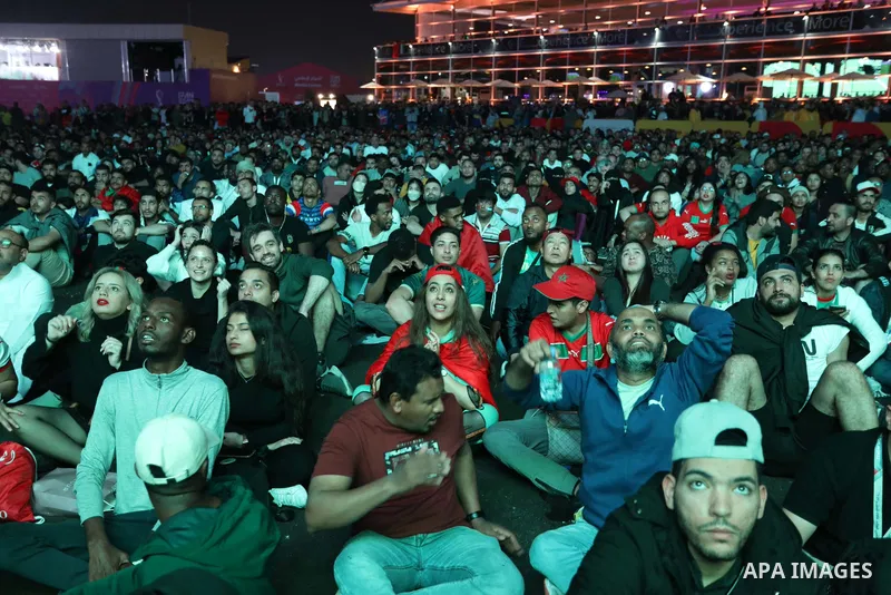 Fans attend on a huge screen the semi-final match between Morocco and France on the Doha Corniche on December 14, 2022. The 2022 FIFA World Cup is an association football tournament, contested by the men's national teams...