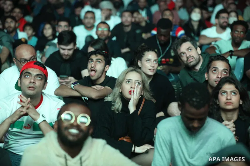 Fans attend on a huge screen the semi-final match between Morocco and France on the Doha Corniche on December 14, 2022. The 2022 FIFA World Cup is an association football tournament, contested by the men's national teams...