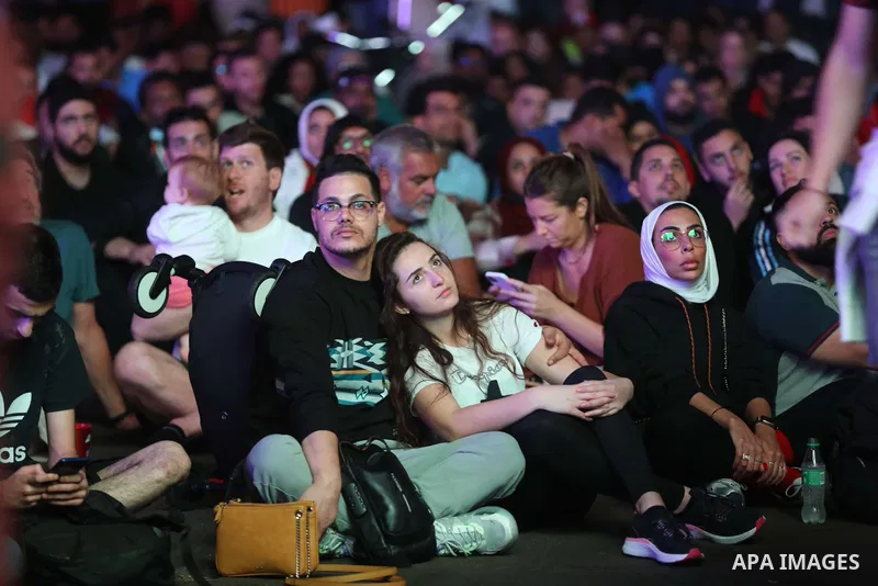 Fans attend on a huge screen the semi-final match between Morocco and France on the Doha Corniche on December 14, 2022. The 2022 FIFA World Cup is an association football tournament, contested by the men's national teams...